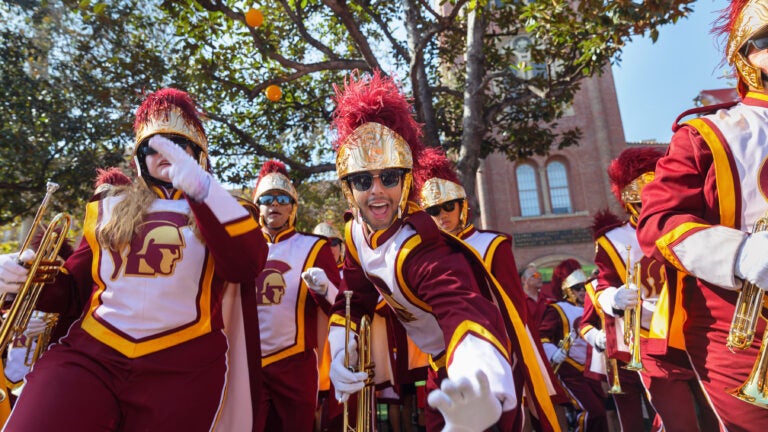 The Trojan Marching Band playing in front of Bovard building