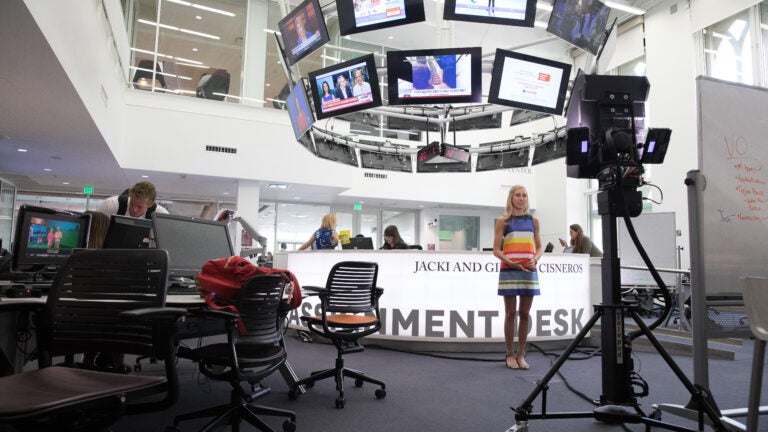 A student recording a news segment at Annenberg School of Journalism.