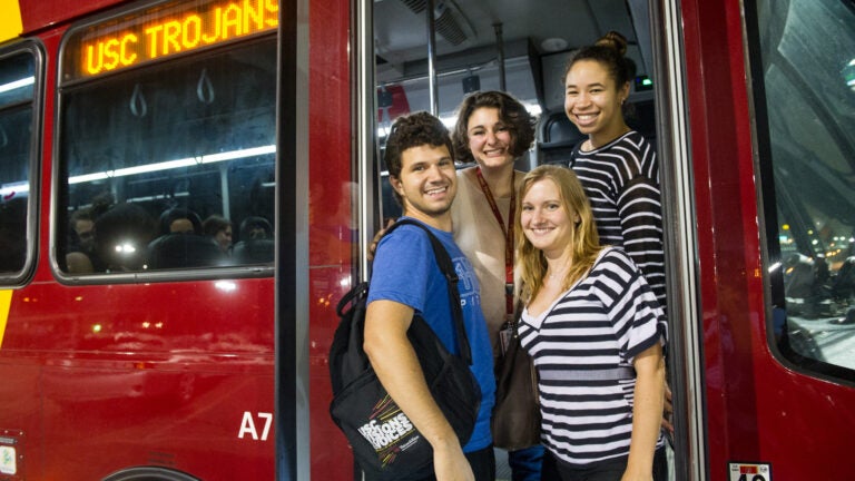 USC students, from left, David Karlsberg, Narine Vartanian, Eva Schaumkell and Kelly Robinson board the bus after a night at the Santa Monica Pier.