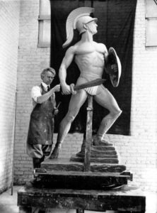 Roger Noble Burnham sculpting Tommy Trojans