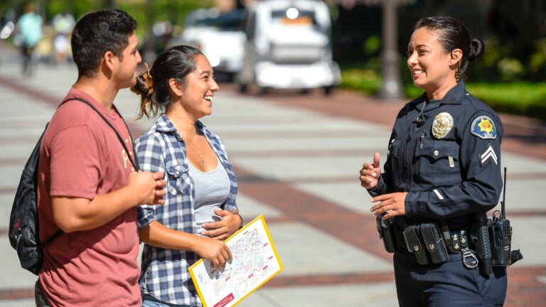 Two people talking in a police officer