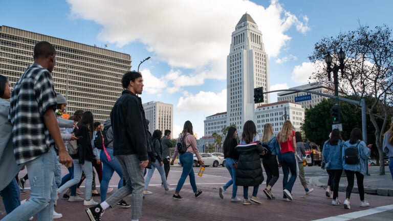 USC freshmen walk by City Hall on the spring admit trip to Little Tokyo and the Arts District.