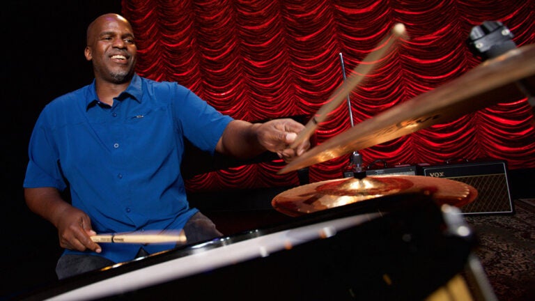 USC Thornton Assistant Professor Will Kennedy gleefully playing the drums