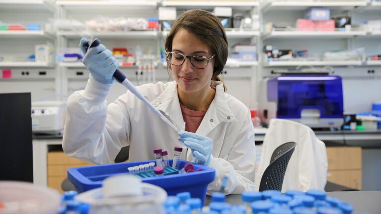 Researcher using tools to collect samples