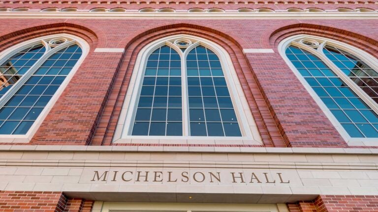 Exterior of Michelson Hall with large windows and brick architecture