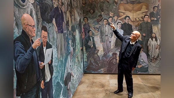 Man looking at a painting