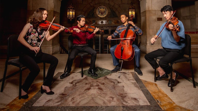 USC Thornton students playing multiple string instruments