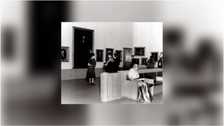 Visitors looking at the art in the newly opened Elizabeth Holmes Fisher Gallery