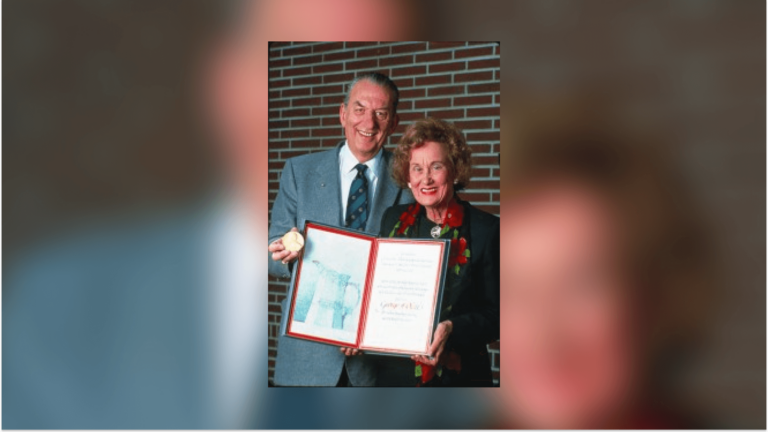 Nobel laureate George A. Olah and benefactor Katherine B. Loker smiling together