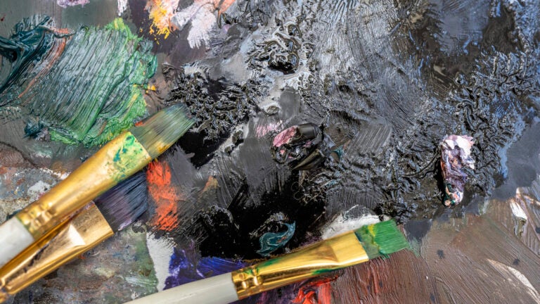A detail of a paint brush up close at a USC Roski art class.