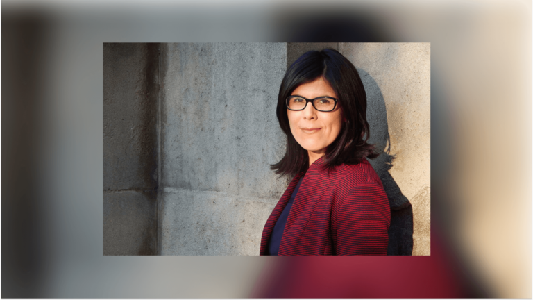 Natalia Molina, a woman with black, shoulder-length hair, glasses, and a maroon jacket.