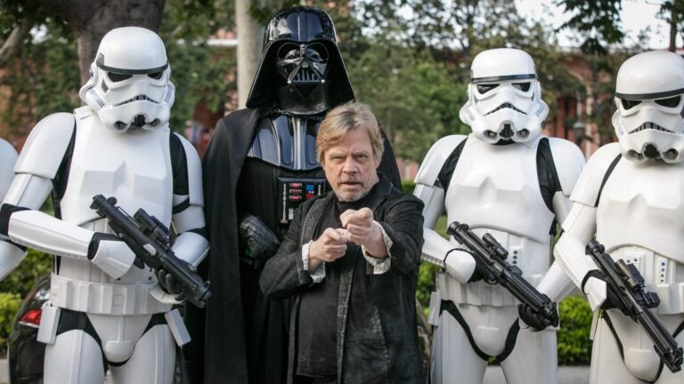 Actor Mark Hamill with Star Wars characters in costume during an event at USC