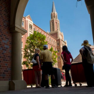 Parents and students wait in line during move in day , Wednesday, August 16, 2017. (Photo/Gus Ruelas)