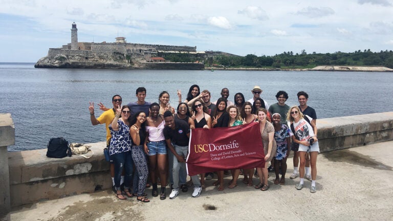 21 USC undergraduates in Europe by the water