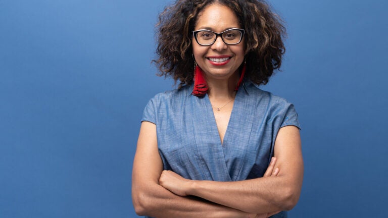 Sydney Kamlager, State Senator from California's 30th district, against a blue background