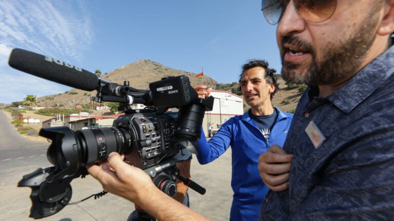 Two men with a camera filming at Catalina Island