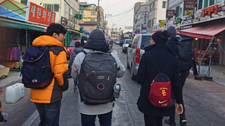 Students walking through the streets in Korea.