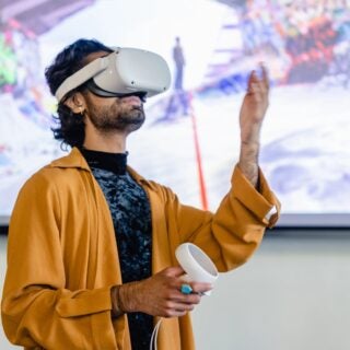 Person playing a interactive game on a virtual reality headset.