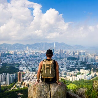 Man enjoying the Hong Kong view from the Lion rock.