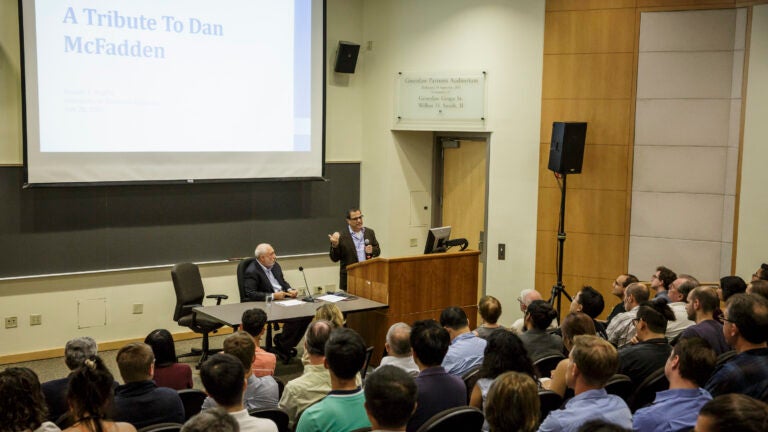 A faculty member leads a large class in one of USC stadium style classrooms