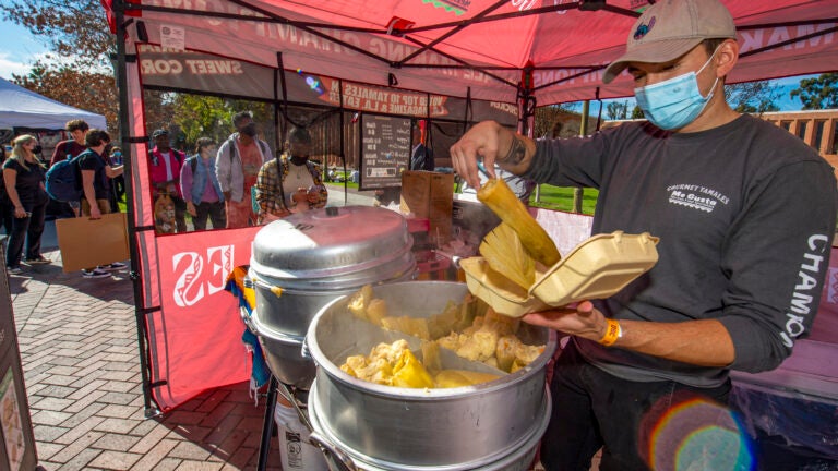 Vendor at USC's Farmer's Market serving tamales