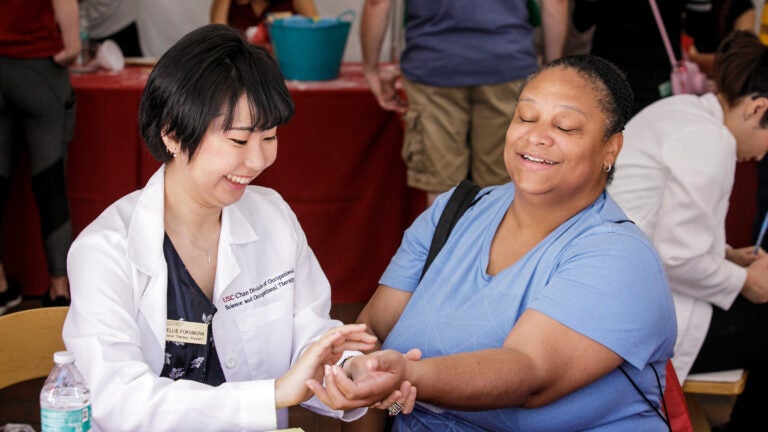USC OT student working with a patient