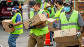 USC volunteers and community members help out during Saturday food distribution at Saint Agnes Catholic Church.