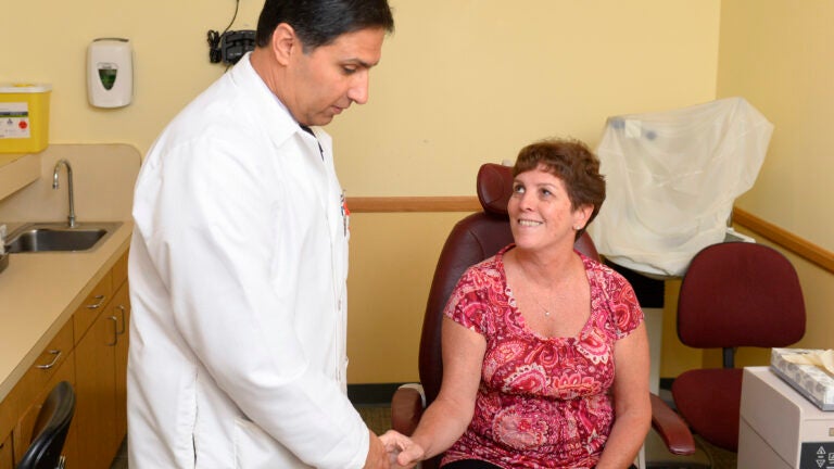 Doctor treating patient at USC's Doheny Eye Institute
