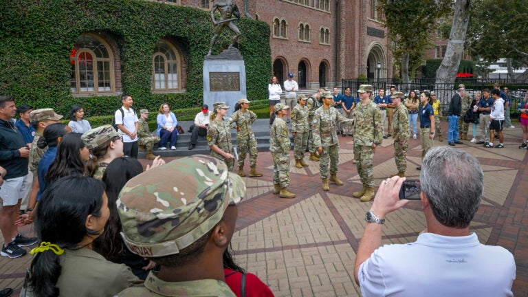 USC ROTC compete in a drill down competition in front of Tommy Trojan
