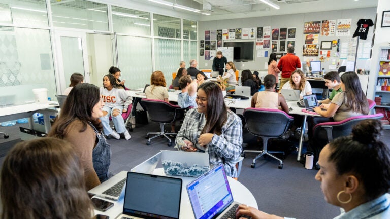 Students, faculty and staff work on projects in the Center for Public Relations office.