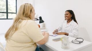 Heavyset woman with clinician