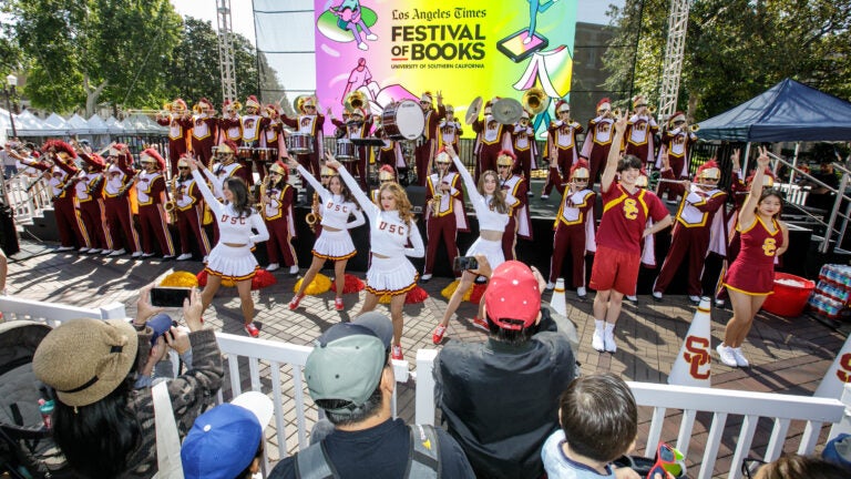 The USC Trojan marching band and song girls perform during the opening ceremonies of the Los Angeles Times Festival of Books