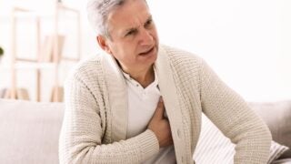 Man holding his chest